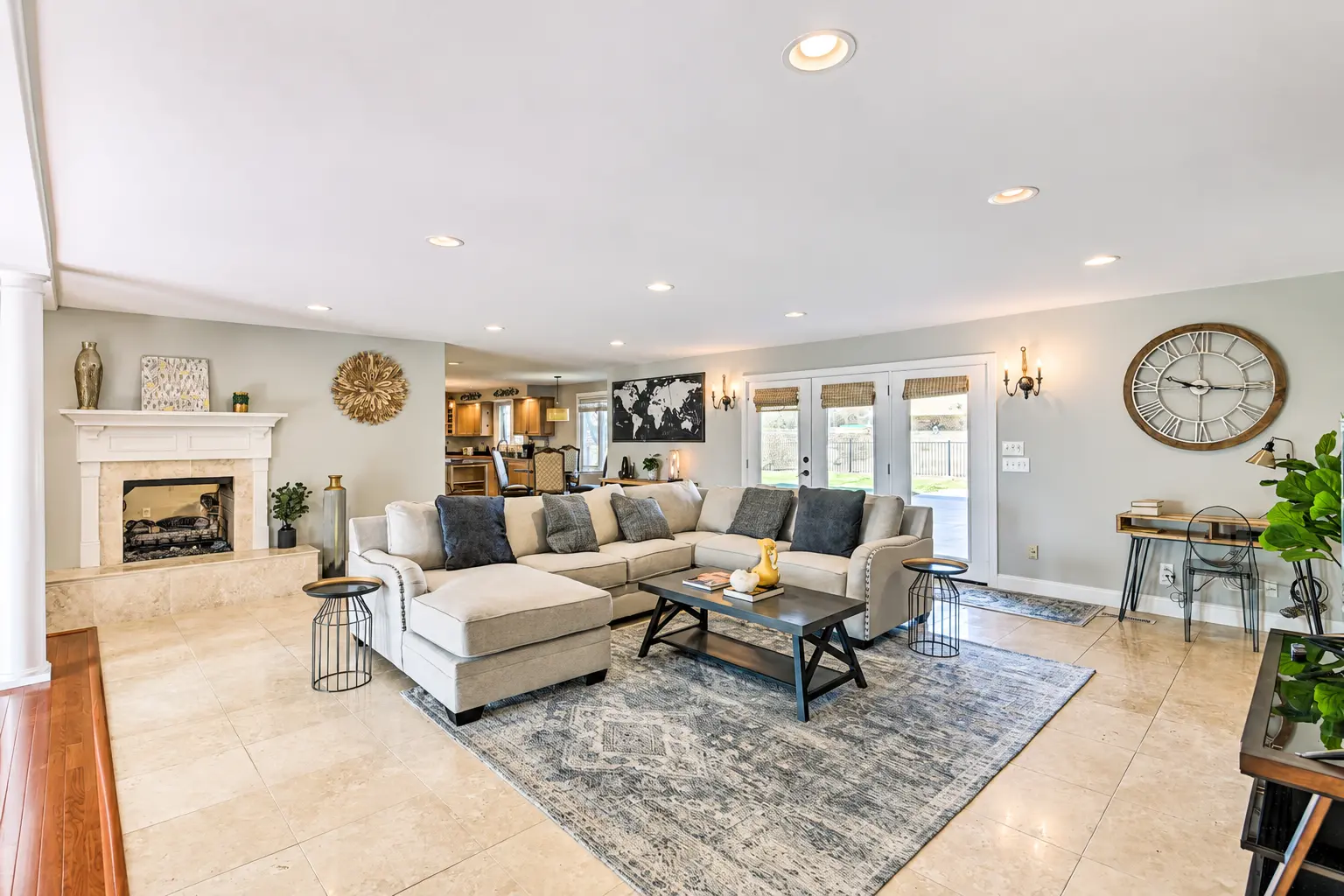 Open living room with fireplace and sectional seating